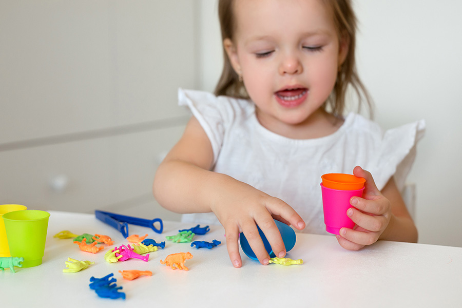 child learning colors while playing