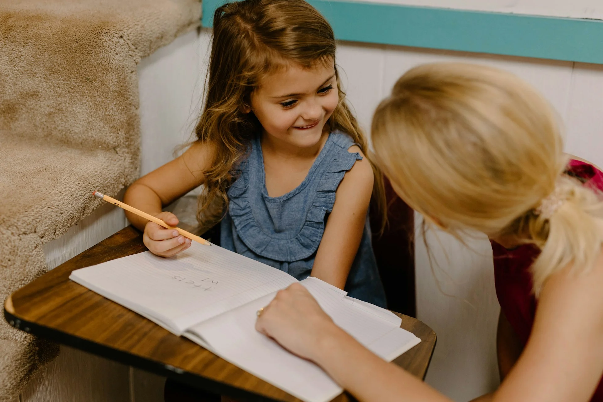 photo - a girl taking a lesson at home. mom wondering can i claim benefits if i homeschool my child uk