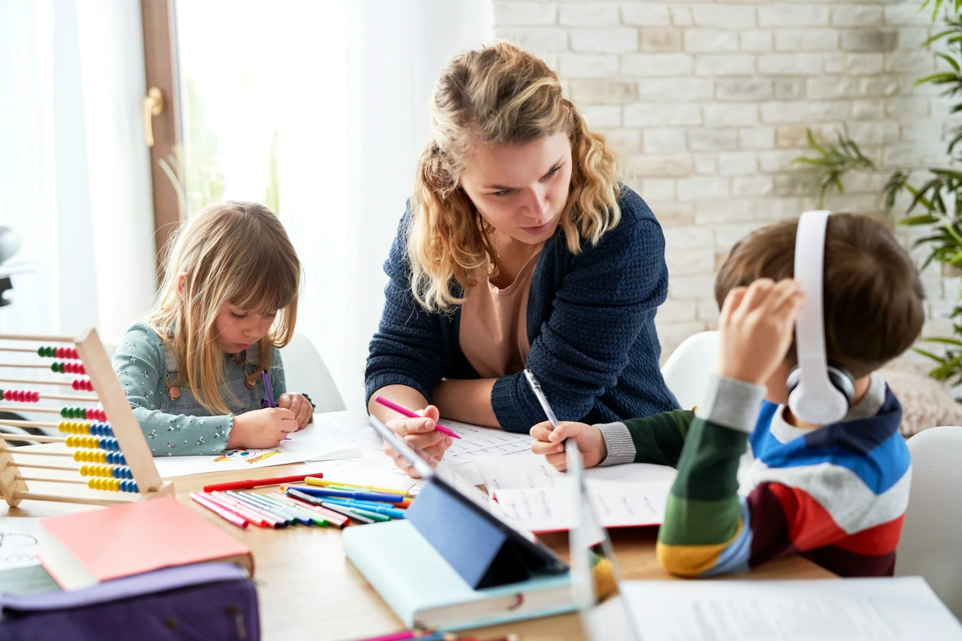 photo - two children on sen register being tutored at home