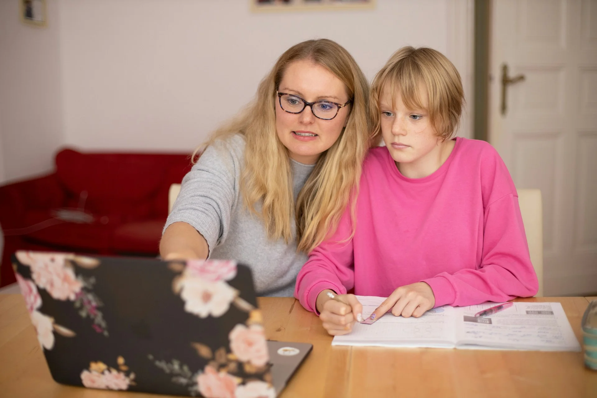 photo - a girl with moderate learning difficulties and a SEN tutor doing homework with the help of ehcp hertfordshire