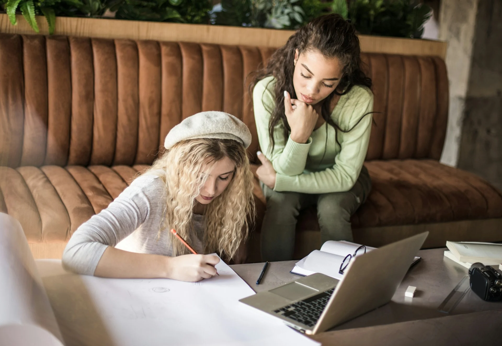 photo - specialised studying session with adhd teenager and a sen tutor in a living room