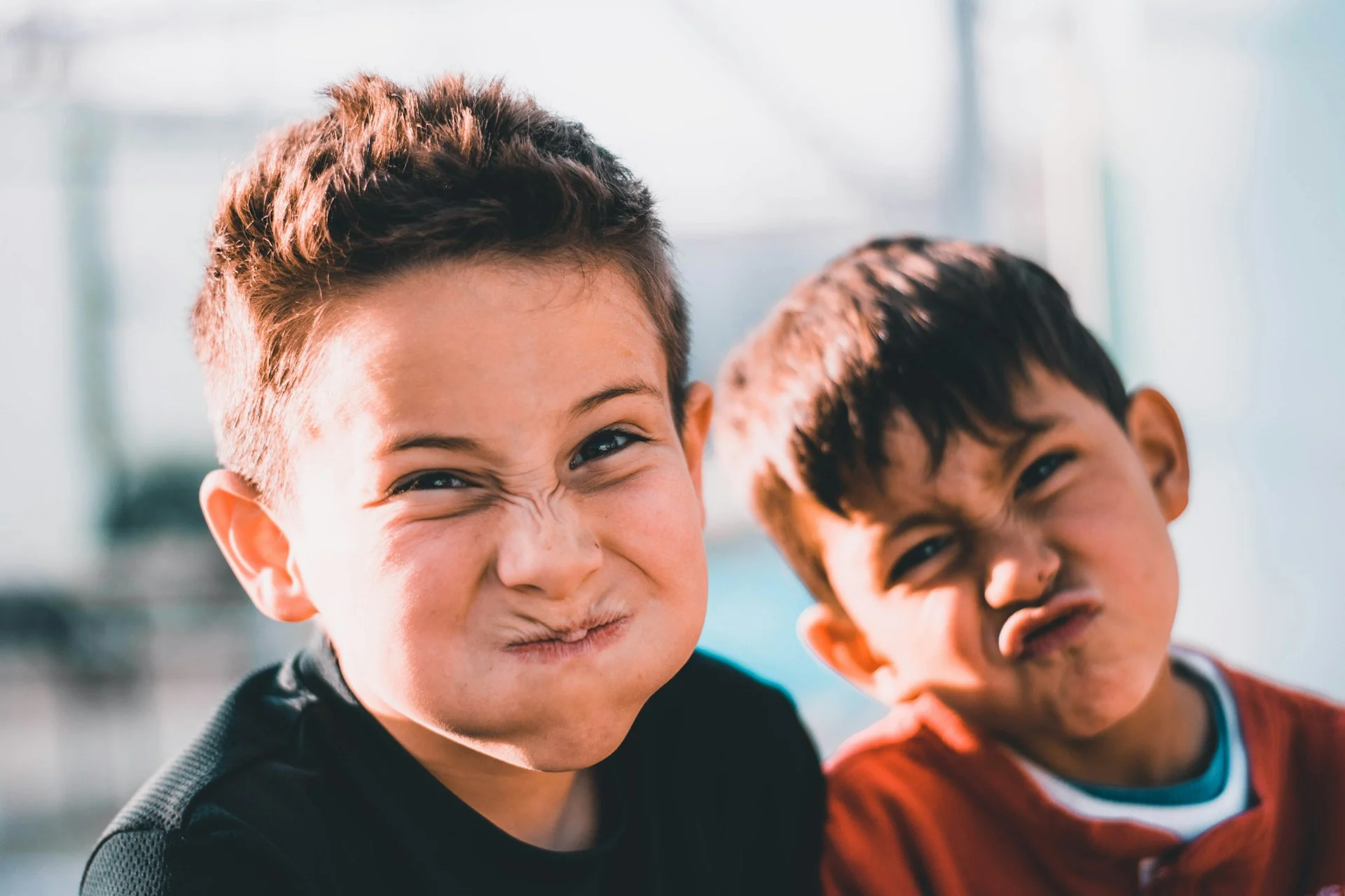 photo - two boys making silly faces in one of UK schools for adhd