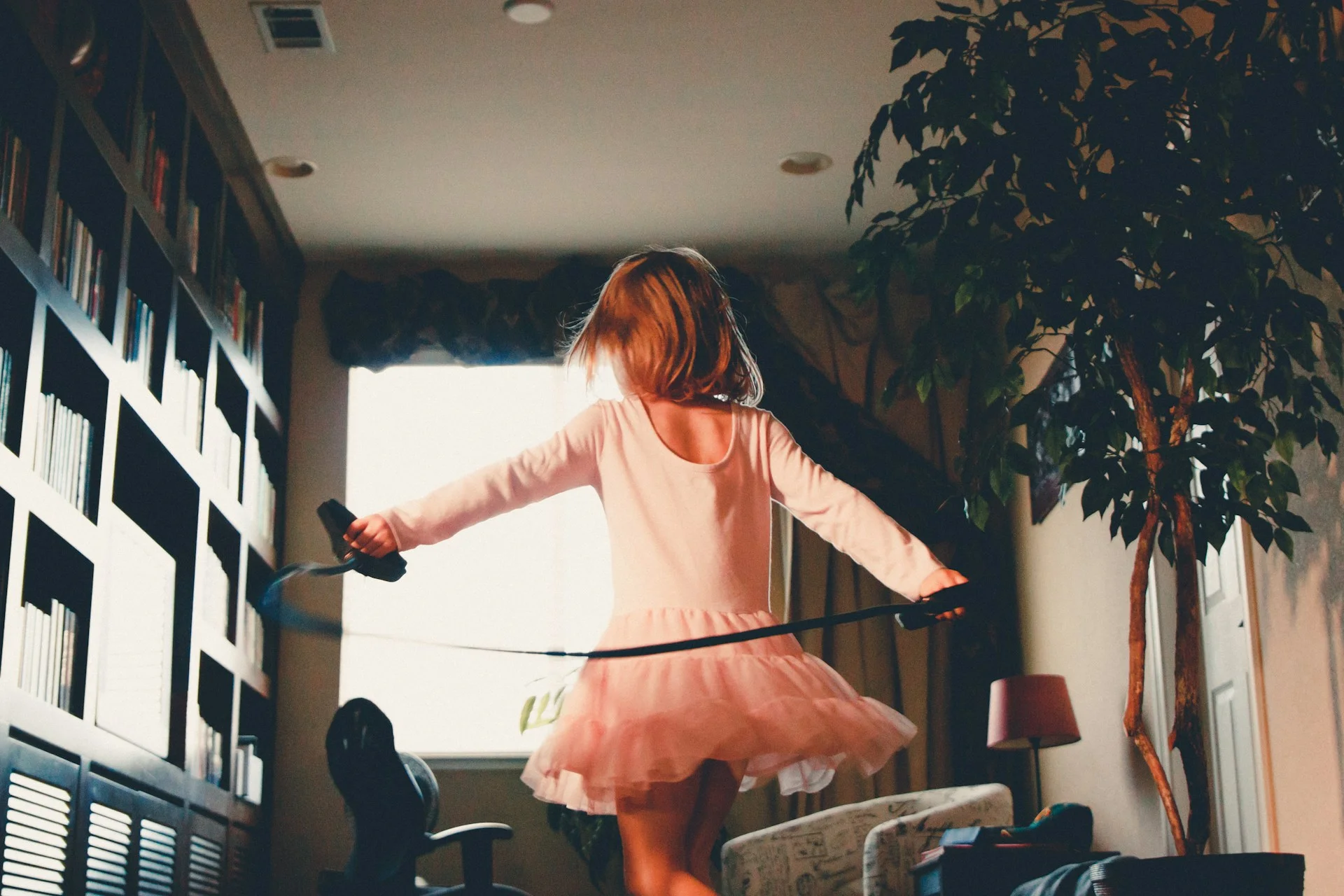 photo - a girl with ebd playing around her home