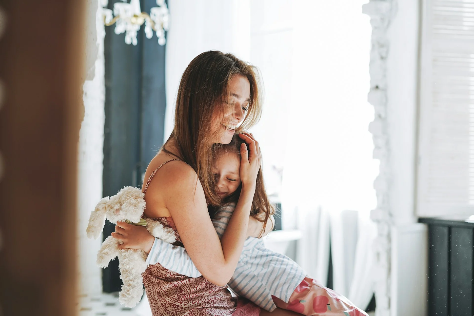 photo - a mother hugging her daughter with semh needs