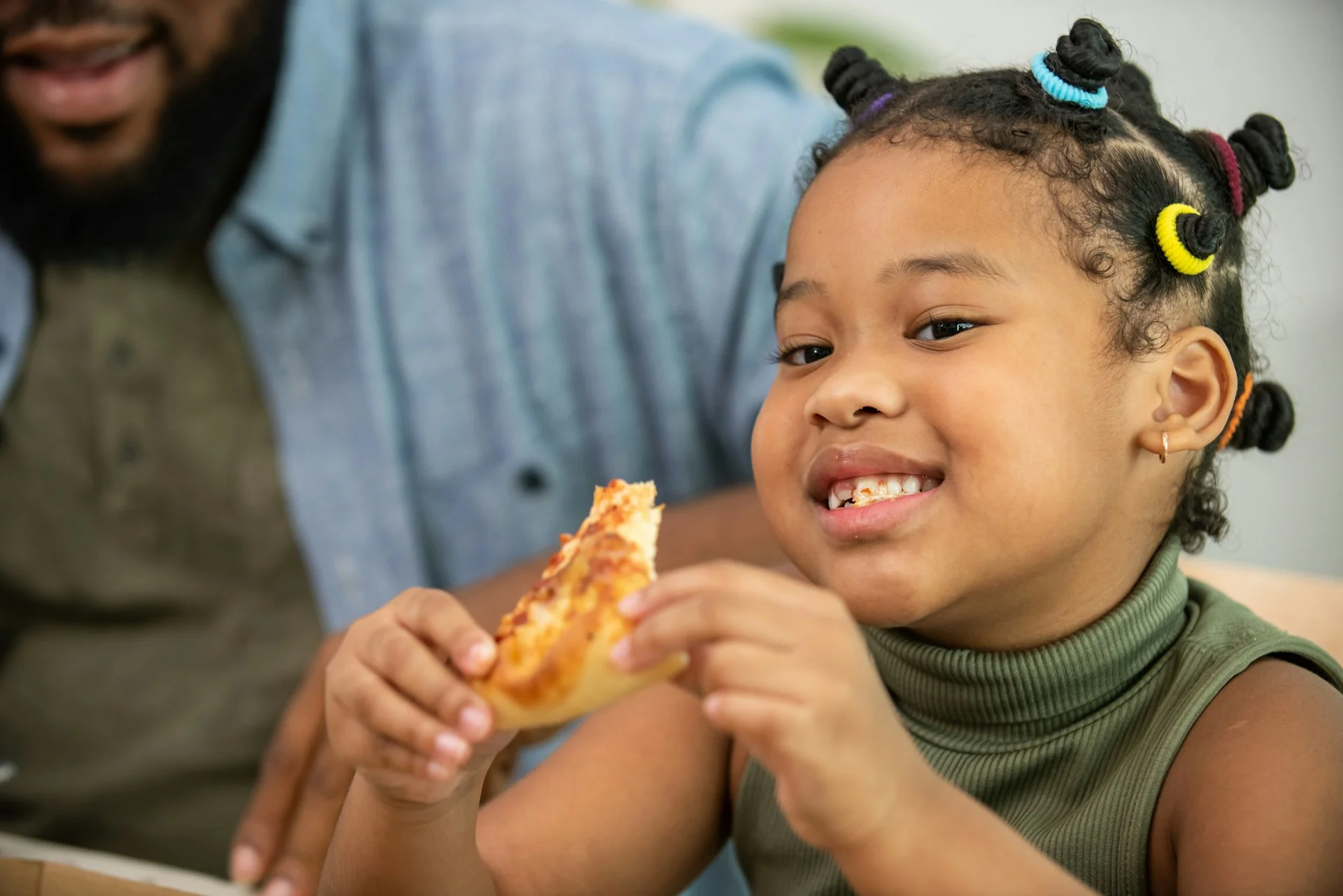 photo - adhd child always hungry a girl eating pizza