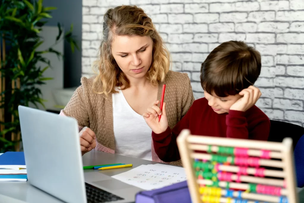 photo - a sen tutor with a boy who has dyslexia and mathematics problems