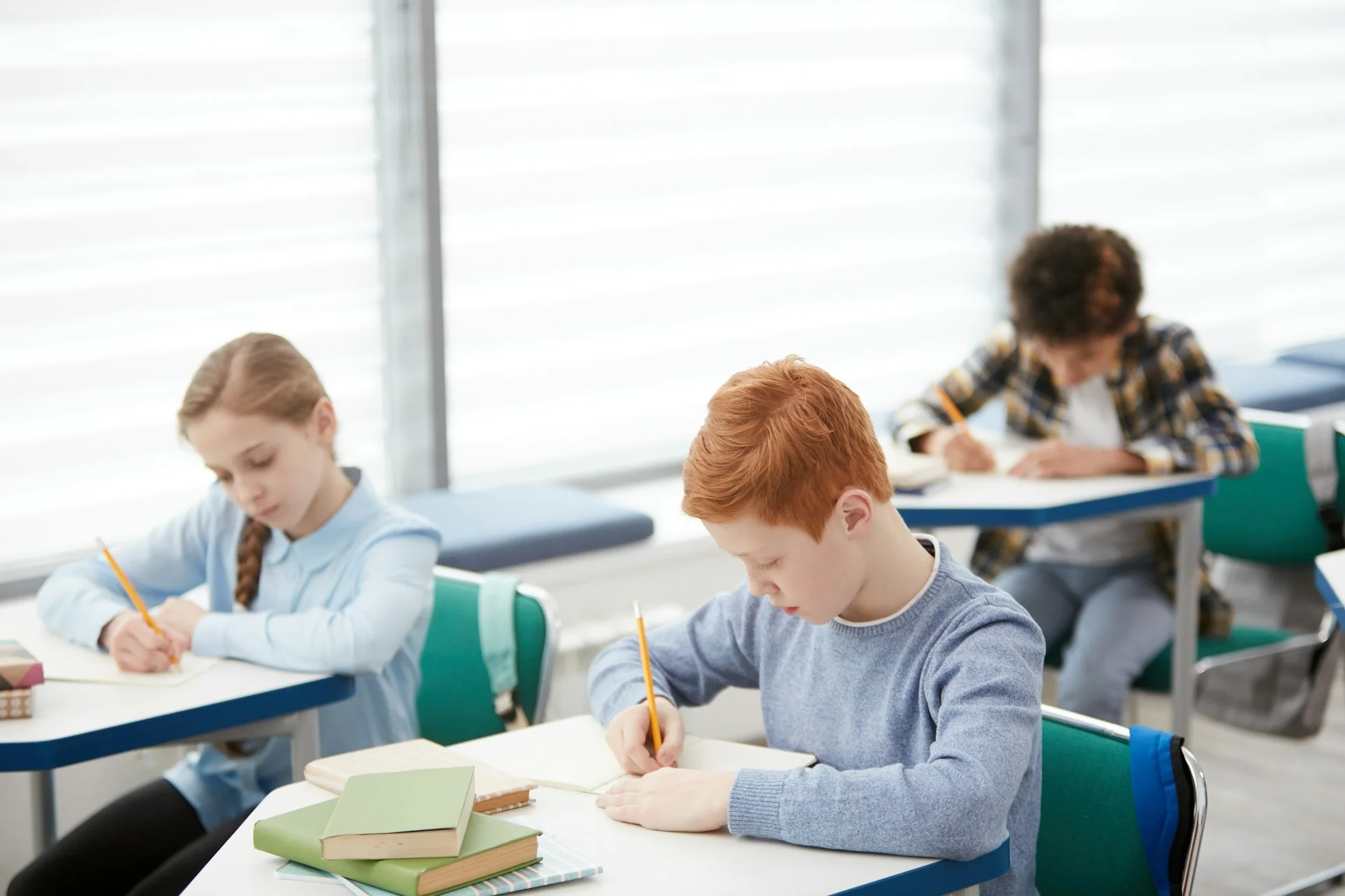 photo - a child with  dyslexia for maths in the classroom