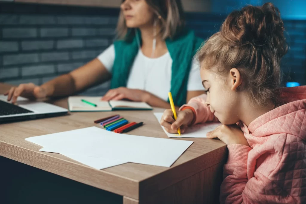 photo - a girl and a her SEN tutor working on the girl's dyspraxia and handwriting