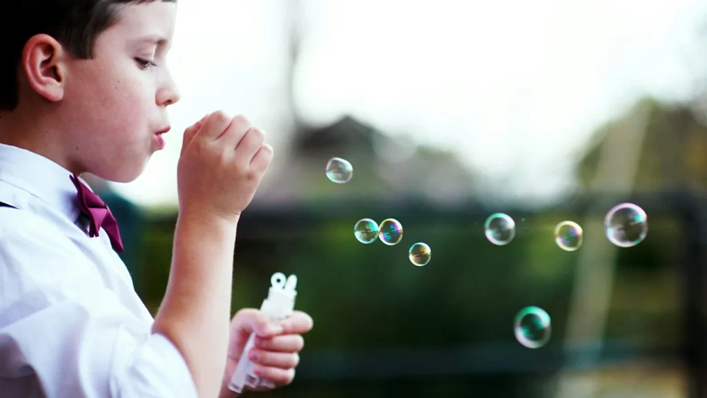 photo - a child with SEN blowing bubbles. what does sen stand for?