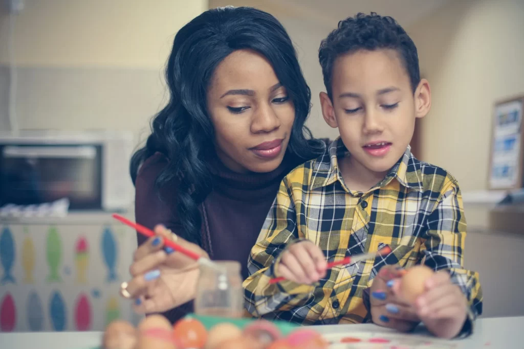 photo - a sen tutor doing homework with a boy on sen plan