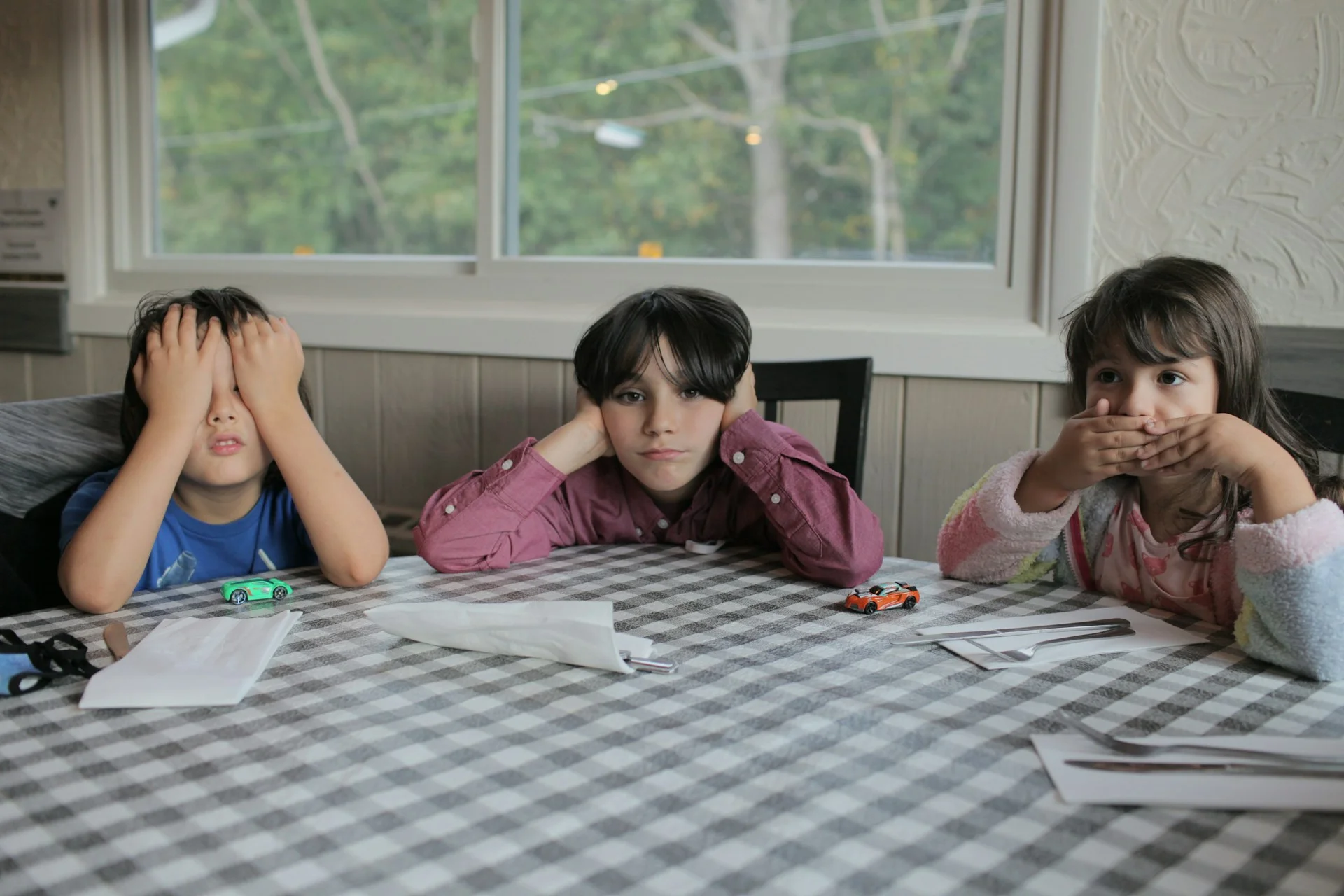 photo - three bored children listening to sen meaning uk