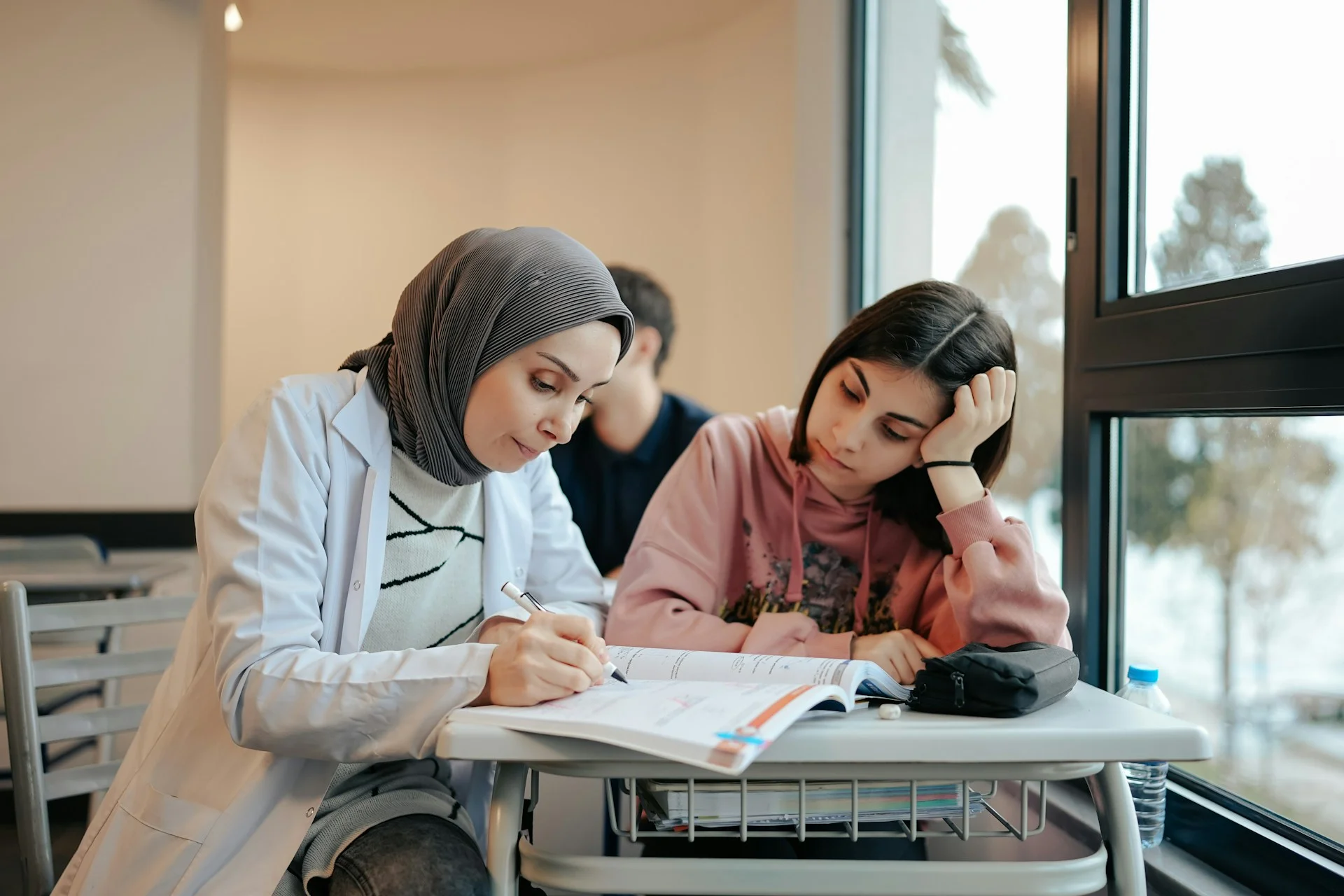 photo - a teacher and a student preparing for exam resits