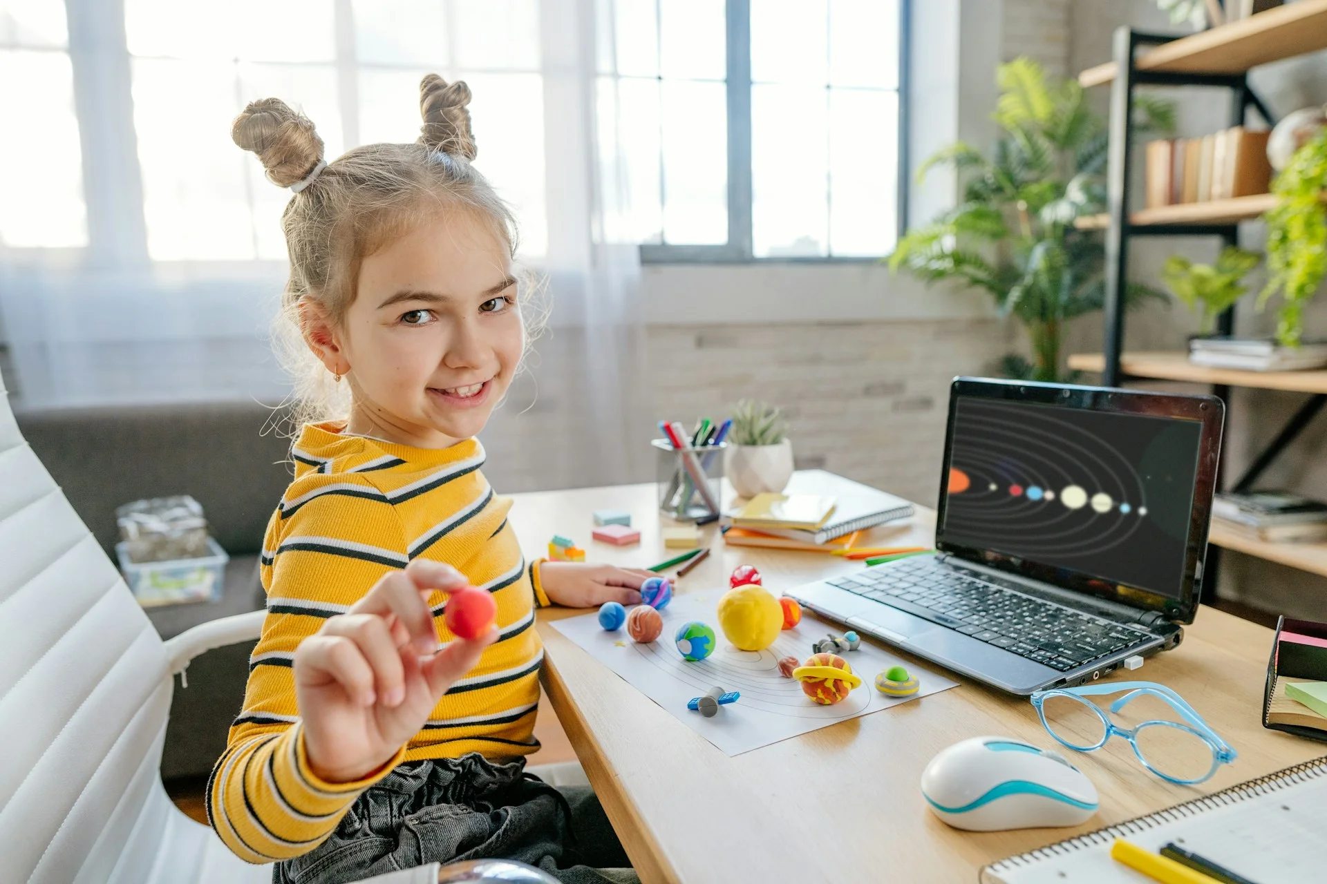 photo - a girl on homeschooling UK doing her homework to match with the british homeschool curriculum