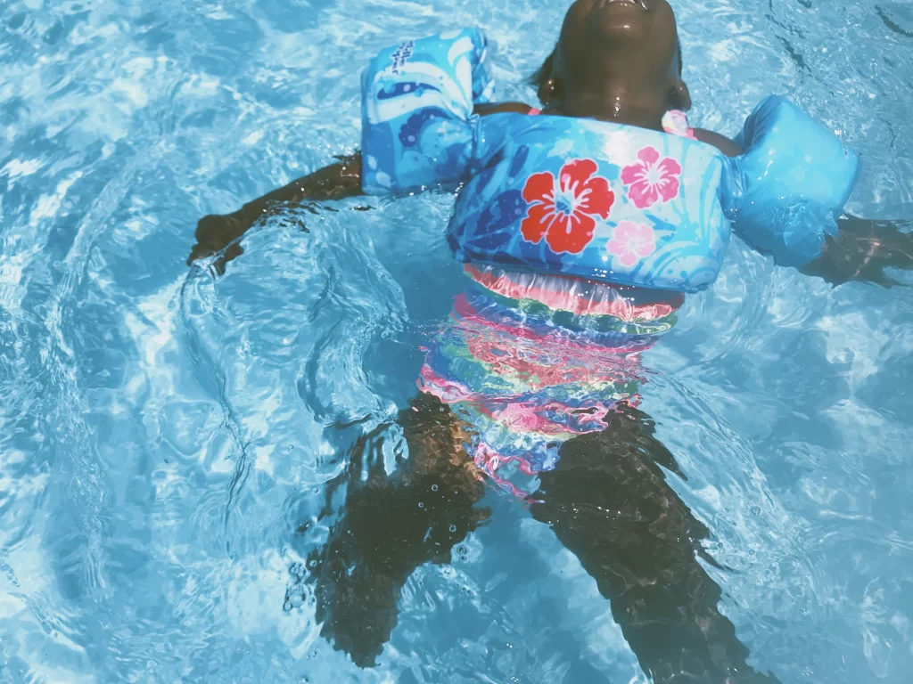 Photo - A child in a pool enjoys SEN activities as part of SEND support for parents.