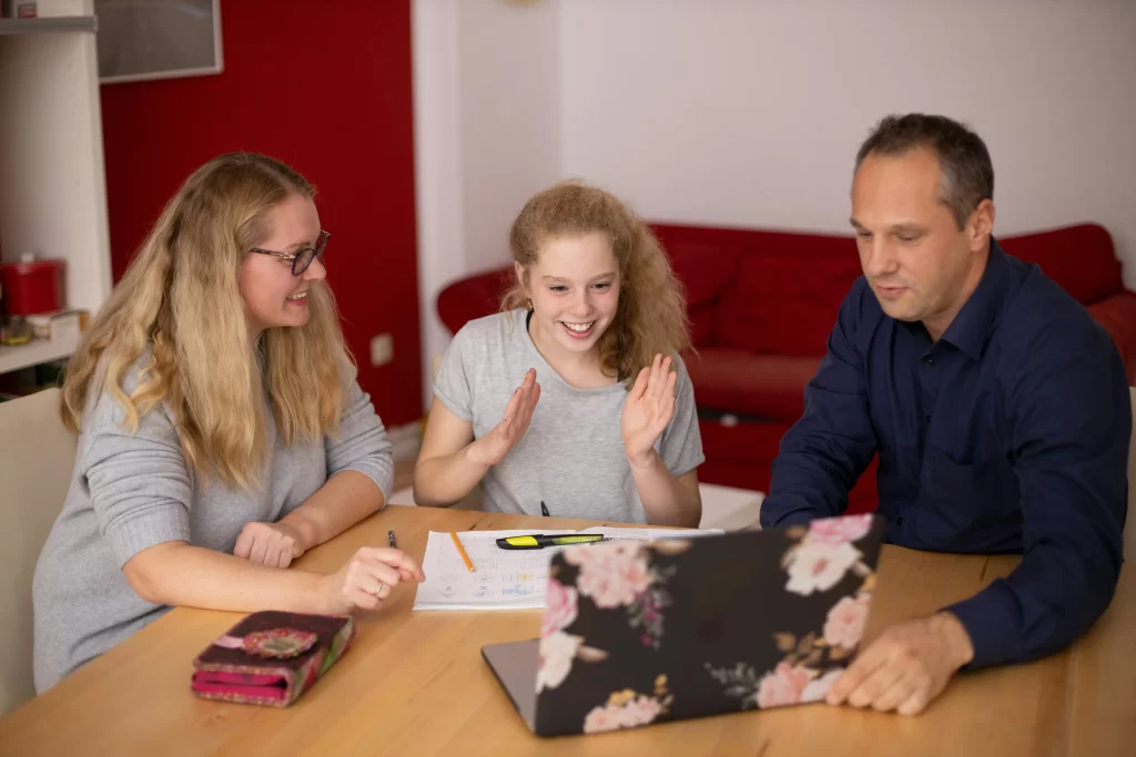 Photo - Family doing homework together with a child with minor dyslexia.