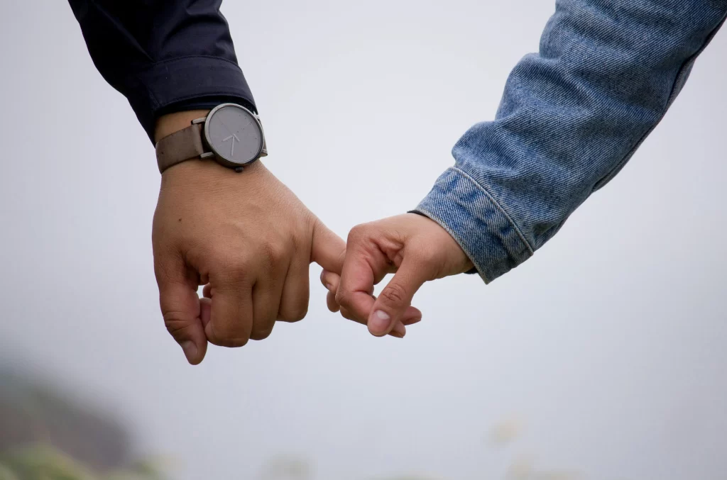 Photo - SEN children holding parents' hand with pinky