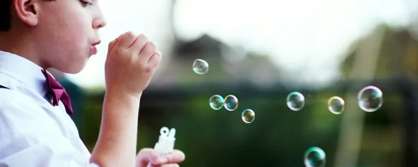 photo - a child with SEN blowing bubbles. what does sen stand for?