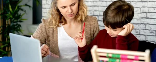 photo - a sen tutor with a boy who has dyslexia and mathematics problems